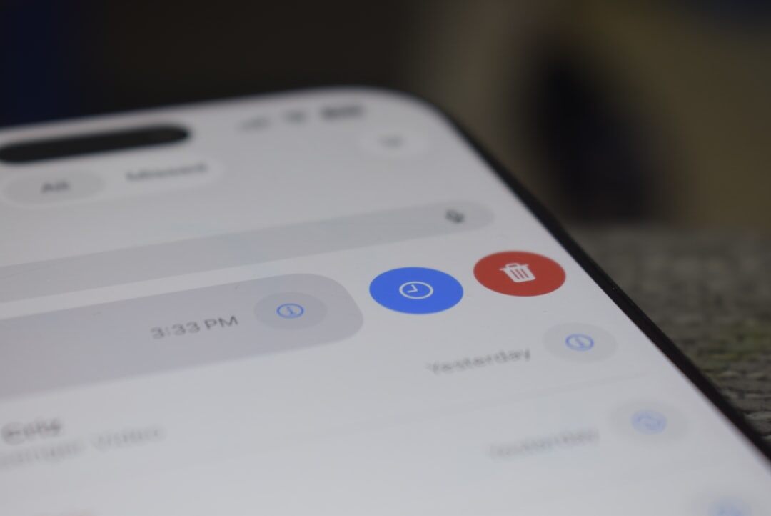 Close-up of a smartphone screen showing a lock icon and messaging app